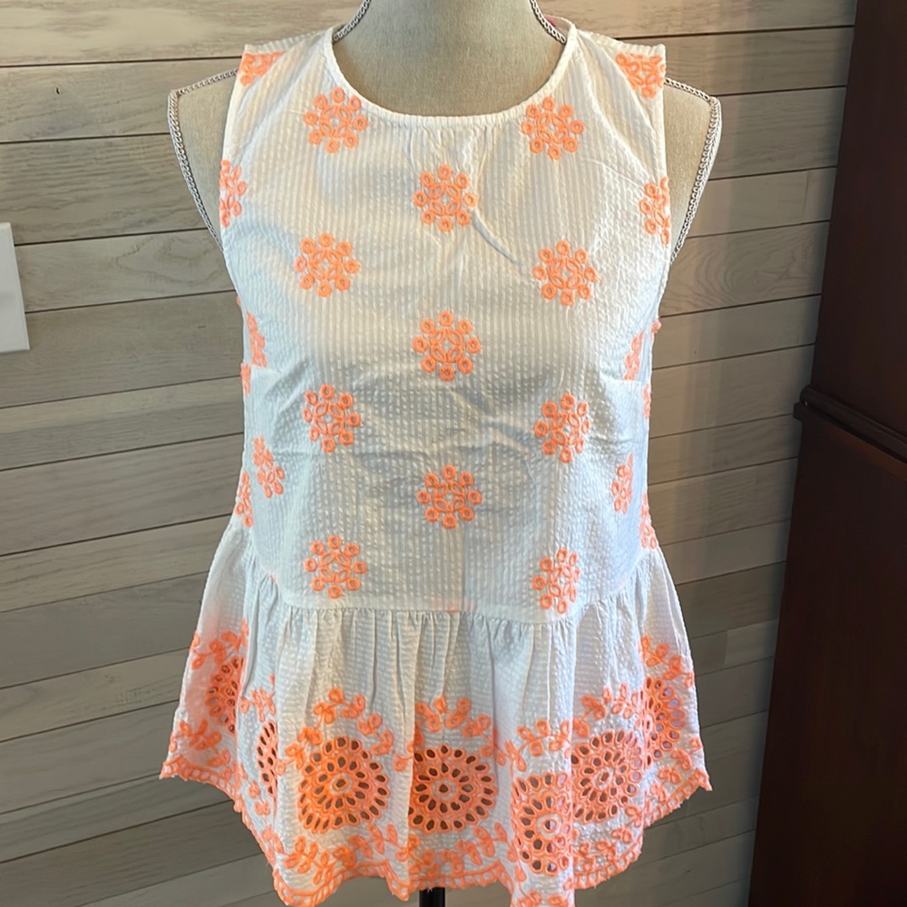 Peplum eyelet top